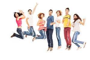 young group of casual, smiling people jumping